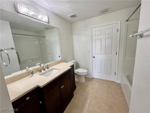 8000 Fountain Mist Blvd, Lehigh Acres, FL 33972 - bathroom featuring vanity, a textured ceiling, a textured wall, tile patterned floors, and bathing tub / shower combination