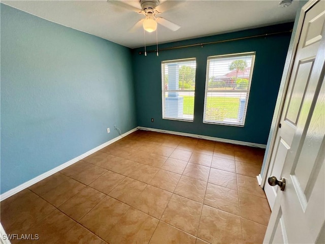 8000 Fountain Mist Blvd, Lehigh Acres, FL 33972 - empty room featuring tile patterned flooring and a ceiling fan