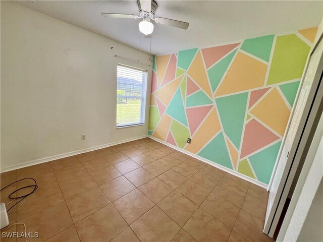 8000 Fountain Mist Blvd, Lehigh Acres, FL 33972 - spare room featuring a ceiling fan and tile patterned flooring