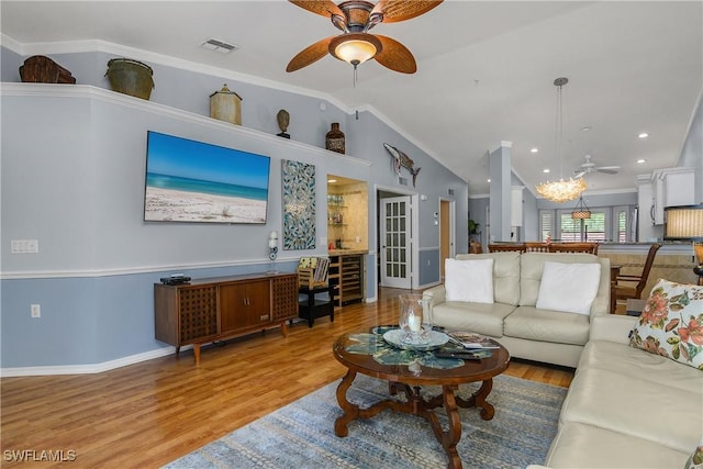2770 Cypress Trace Cir Unit 2428, Naples, FL 34119 - living room featuring a ceiling fan, wood finished floors, lofted ceiling, and crown molding
