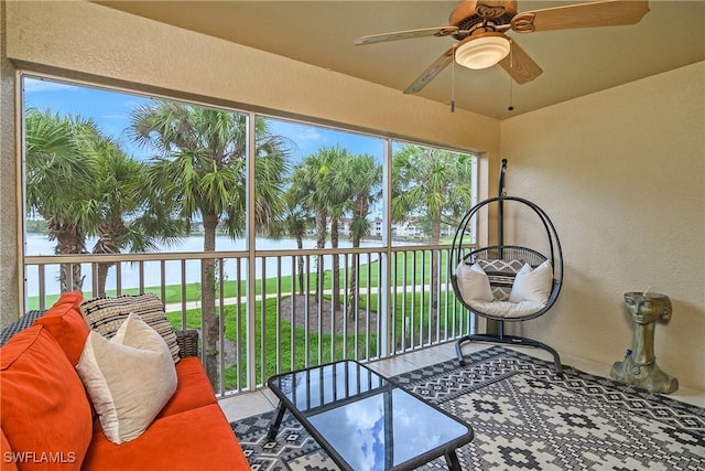 2770 Cypress Trace Cir Unit 2428, Naples, FL 34119 - sunroom / solarium featuring a ceiling fan, a water view, and outdoor lounge area
