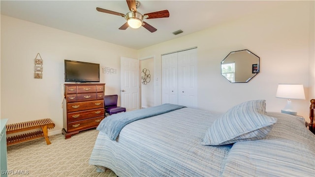 301 SE 26th Ter, Cape Coral, FL 33904 - bedroom featuring a closet, light carpet, and a ceiling fan