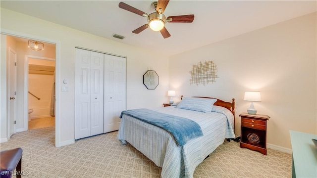 301 SE 26th Ter, Cape Coral, FL 33904 - bedroom featuring light carpet, a closet, and a ceiling fan