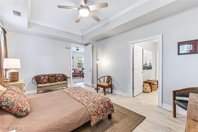 28082 Sosta Ln Unit 2, Bonita Springs, FL 34135 - bedroom featuring a raised ceiling, ornamental molding, and a ceiling fan