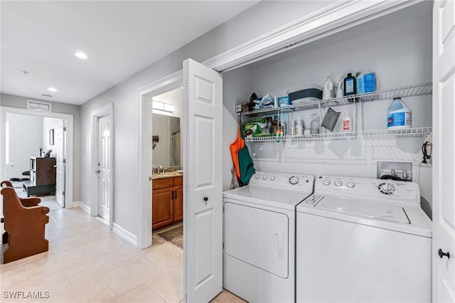 28082 Sosta Ln Unit 2, Bonita Springs, FL 34135 - laundry room with separate washer and dryer, recessed lighting, and light tile patterned floors