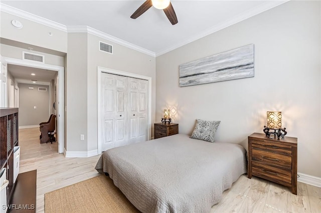 28082 Sosta Ln Unit 2, Bonita Springs, FL 34135 - bedroom with crown molding, a closet, light wood-style floors, and a ceiling fan