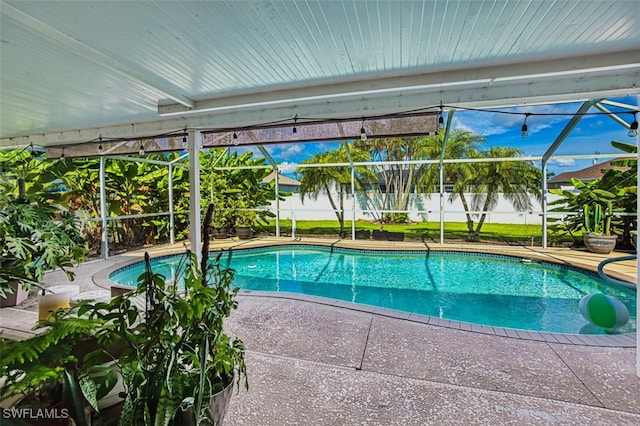 4512 SW 20th Ave, Cape Coral, FL 33914 - view of swimming pool featuring glass enclosure and a patio area