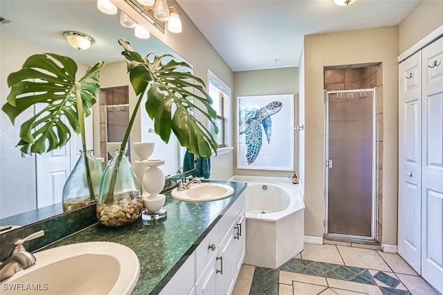 4512 SW 20th Ave, Cape Coral, FL 33914 - full bath with a shower stall, double vanity, a garden tub, and tile patterned floors