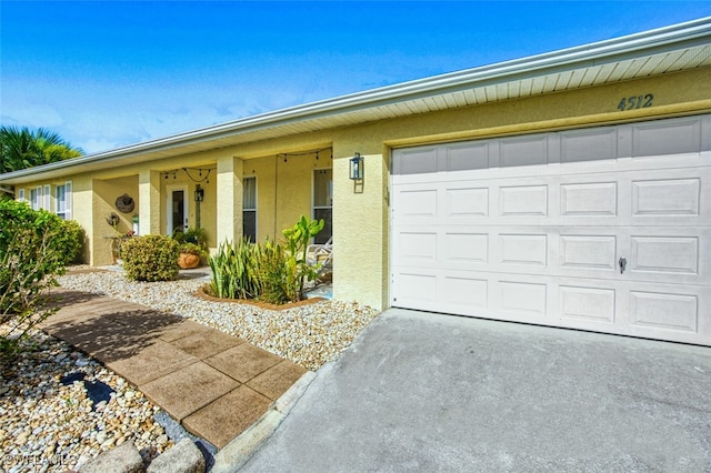 4512 SW 20th Ave, Cape Coral, FL 33914 - view of front facade featuring stucco siding and concrete driveway