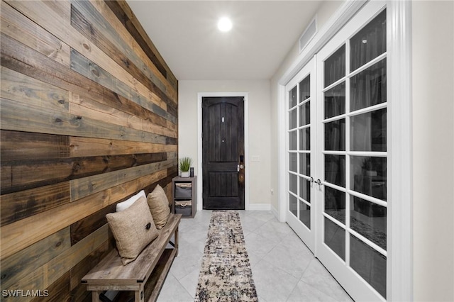 3336 Hampton Blvd, Alva, FL 33920 - doorway with wooden walls, french doors, and tile patterned flooring