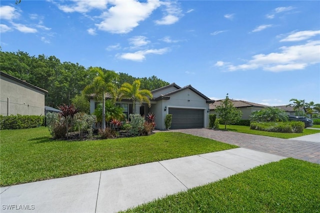 3336 Hampton Blvd, Alva, FL 33920 - ranch-style house featuring decorative driveway, a garage, a front lawn, and stucco siding