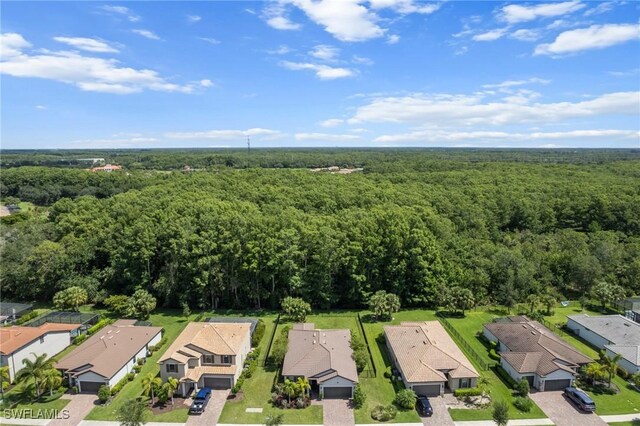 3336 Hampton Blvd, Alva, FL 33920 - aerial perspective of suburban area featuring a heavily wooded area