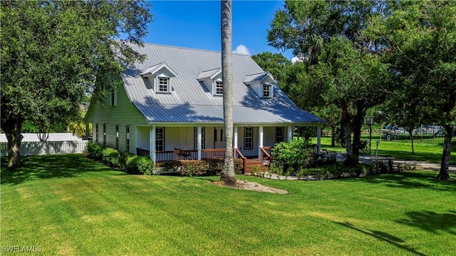 202 N Cypress St, Labelle, FL 33935 - view of front of property featuring a porch and a metal roof