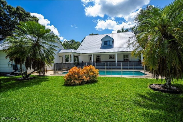 202 N Cypress St, Labelle, FL 33935 - rear view of property featuring a metal roof