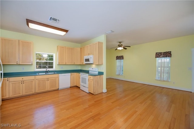 202 N Cypress St, Labelle, FL 33935 - kitchen with white appliances, light wood-style flooring, light brown cabinets, open floor plan, and a ceiling fan
