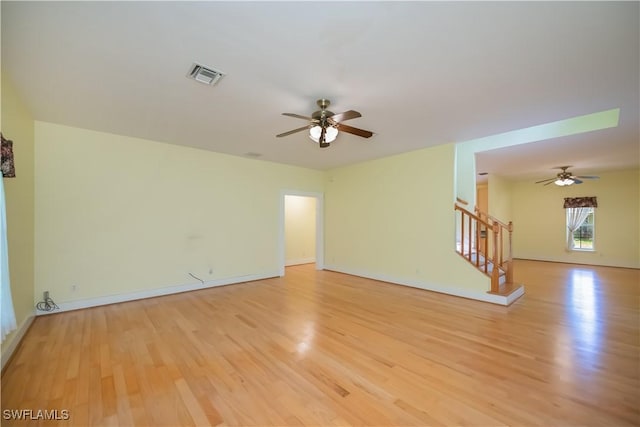 202 N Cypress St, Labelle, FL 33935 - unfurnished room with ceiling fan, light wood-type flooring, and stairway
