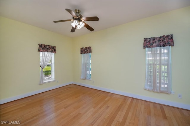 202 N Cypress St, Labelle, FL 33935 - empty room featuring wood finished floors and a ceiling fan