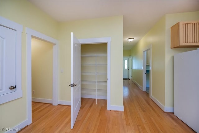 202 N Cypress St, Labelle, FL 33935 - hall with light wood-style flooring and baseboards