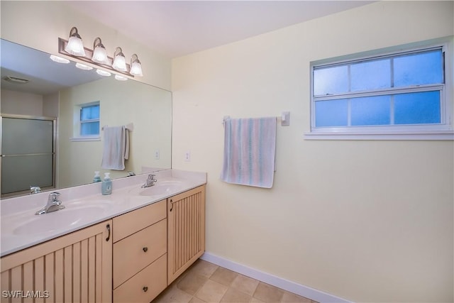 202 N Cypress St, Labelle, FL 33935 - full bath with healthy amount of natural light, double vanity, and a shower with shower door