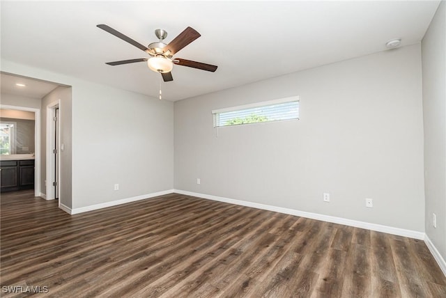 849 Haleybury St, Port Charlotte, FL 33948 - spare room featuring a smoke detector, plenty of natural light, dark wood-type flooring, and recessed lighting