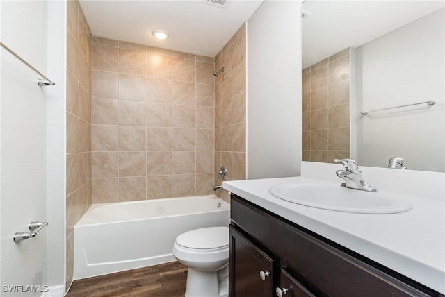 849 Haleybury St, Port Charlotte, FL 33948 - bathroom featuring vanity, wood finished floors, and bathing tub / shower combination