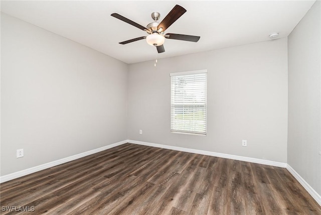 849 Haleybury St, Port Charlotte, FL 33948 - spare room with dark wood-style flooring, ceiling fan, and a smoke detector