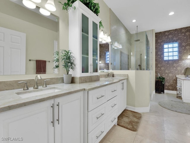 23220 Whispering Ridge Dr, Estero, FL 34135 - bathroom with wallpapered walls, double vanity, walk in shower, and recessed lighting
