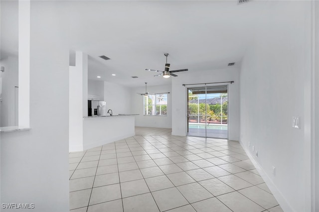 973 Summerfield Dr, Naples, FL 34120 - unfurnished living room with ceiling fan and light tile patterned flooring