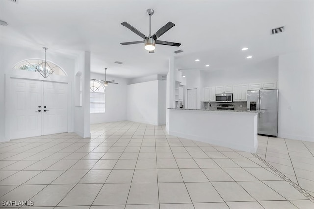 973 Summerfield Dr, Naples, FL 34120 - unfurnished living room featuring ceiling fan, a chandelier, recessed lighting, and light tile patterned floors
