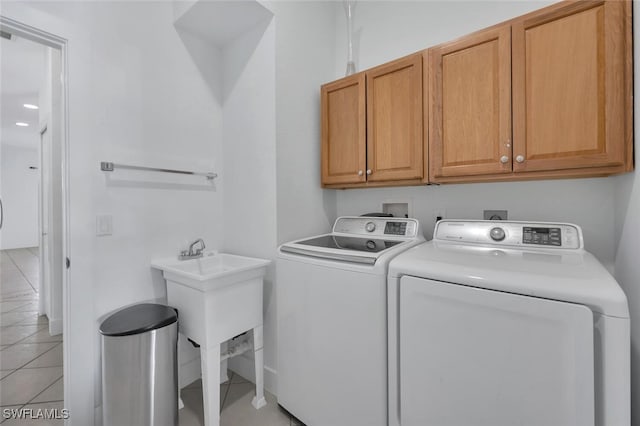 973 Summerfield Dr, Naples, FL 34120 - washroom with cabinet space, washer and dryer, and light tile patterned floors