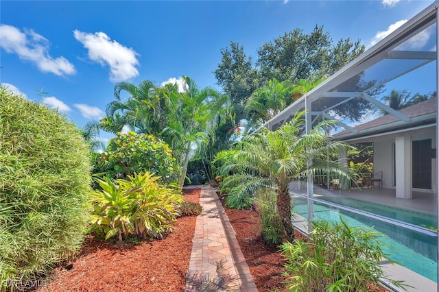 973 Summerfield Dr, Naples, FL 34120 - view of yard featuring a lanai, an outdoor pool, and a patio area
