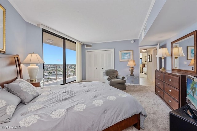 176 S Collier Blvd Unit 1107, Marco Island, FL 34145 - bedroom featuring floor to ceiling windows, carpet floors, ornamental molding, access to outside, and a closet