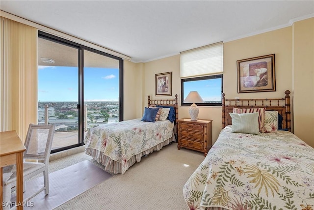 176 S Collier Blvd Unit 1107, Marco Island, FL 34145 - bedroom featuring light carpet, multiple windows, access to exterior, ornamental molding, and a wall of windows