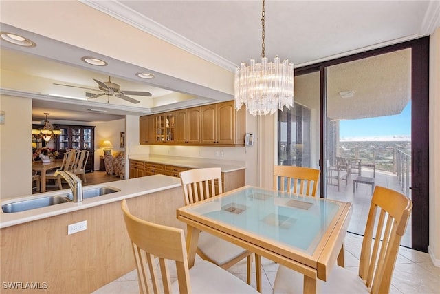176 S Collier Blvd Unit 1107, Marco Island, FL 34145 - dining area featuring a chandelier, light tile patterned floors, crown molding, expansive windows, and ceiling fan