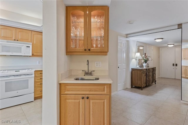176 S Collier Blvd Unit 1107, Marco Island, FL 34145 - kitchen with white appliances, light tile patterned flooring, light countertops, glass insert cabinets, and light brown cabinetry