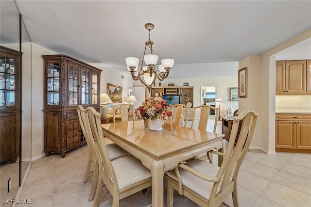 176 S Collier Blvd Unit 1107, Marco Island, FL 34145 - dining area with a chandelier and light tile patterned floors