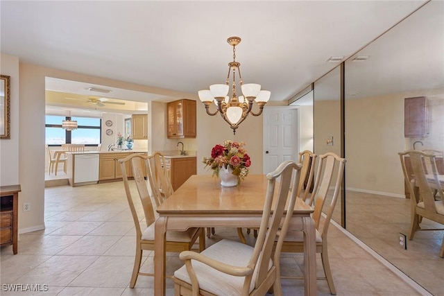 176 S Collier Blvd Unit 1107, Marco Island, FL 34145 - dining room featuring a chandelier, light tile patterned floors, and ceiling fan