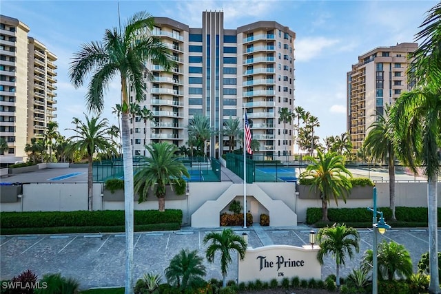 176 S Collier Blvd Unit 1107, Marco Island, FL 34145 - view of apartment building / complex featuring uncovered parking