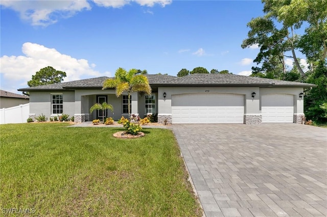 4732 NW 39th Ave, Cape Coral, FL 33993 - view of front facade featuring stucco siding, an attached garage, decorative driveway, and stone siding
