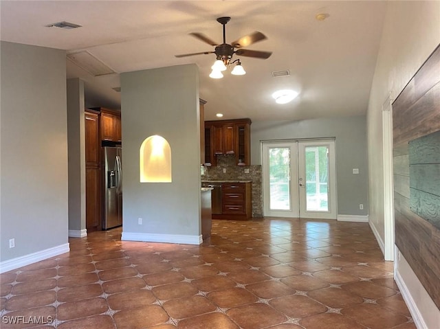 914 Avery St E, Lehigh Acres, FL 33974 - kitchen featuring stainless steel fridge with ice dispenser, ceiling fan, lofted ceiling, french doors, and dark tile patterned floors
