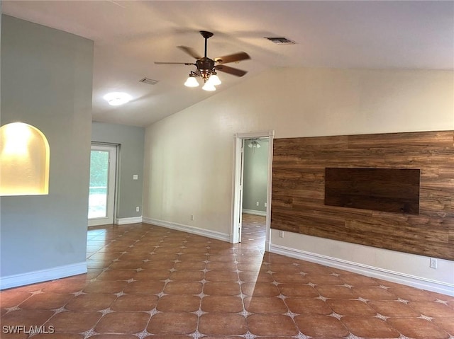 914 Avery St E, Lehigh Acres, FL 33974 - unfurnished living room with a ceiling fan, lofted ceiling, and tile patterned floors
