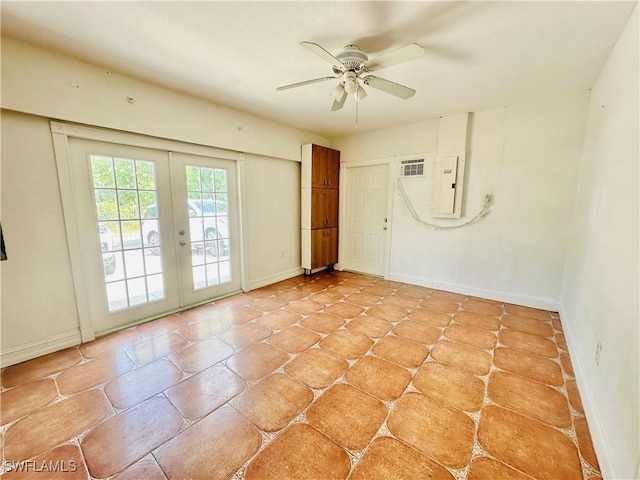 914 Avery St E, Lehigh Acres, FL 33974 - empty room featuring electric panel, french doors, and a ceiling fan