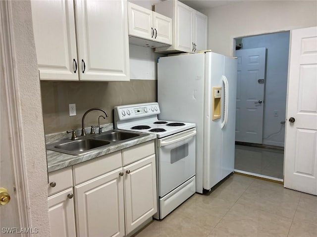914 Avery St E, Lehigh Acres, FL 33974 - kitchen featuring white appliances, white cabinetry, light countertops, and light tile patterned floors