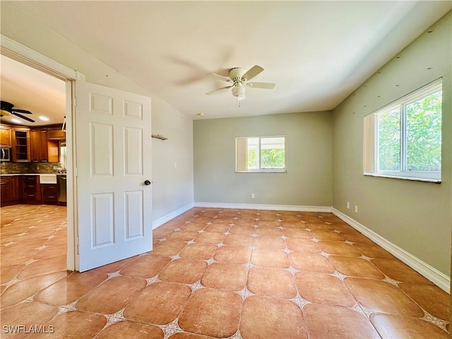 914 Avery St E, Lehigh Acres, FL 33974 - spare room featuring a ceiling fan and light tile patterned floors