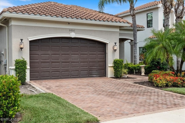 3051 Hudson Ter, Naples, FL 34119 - garage with decorative driveway