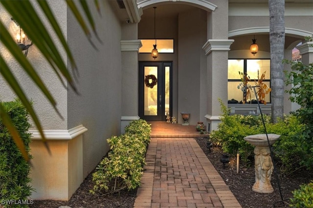 3051 Hudson Ter, Naples, FL 34119 - doorway to property with a porch and stucco siding