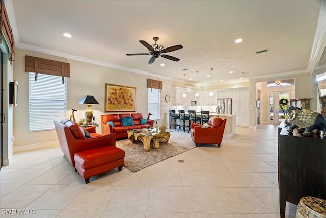 3051 Hudson Ter, Naples, FL 34119 - living area with light tile patterned floors, recessed lighting, ornamental molding, and ceiling fan