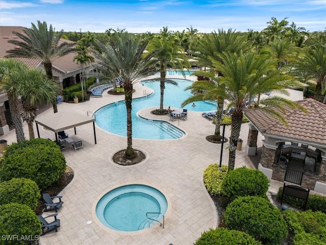 3051 Hudson Ter, Naples, FL 34119 - community pool featuring a community hot tub and a patio