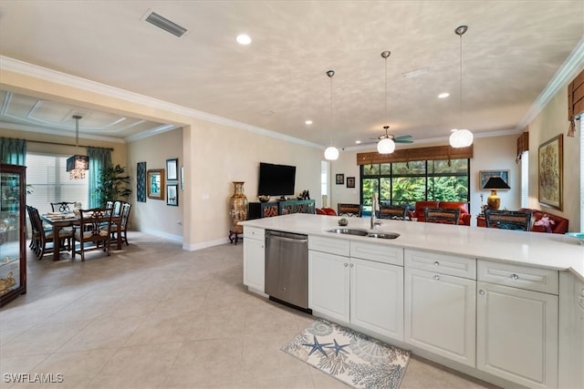 3051 Hudson Ter, Naples, FL 34119 - kitchen with dishwasher, open floor plan, light tile patterned floors, light countertops, and white cabinetry