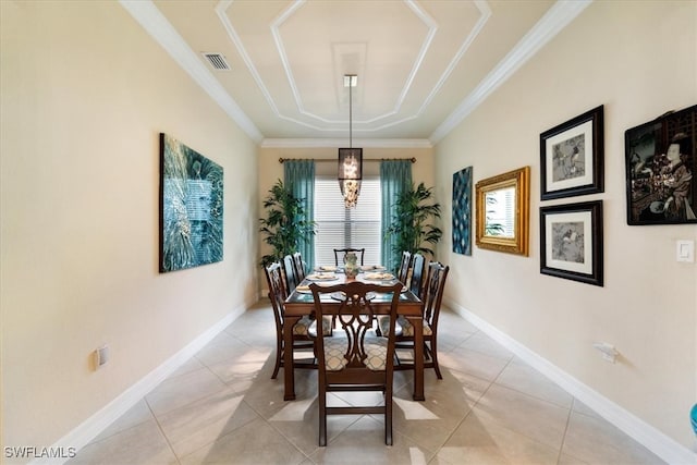 3051 Hudson Ter, Naples, FL 34119 - dining space with crown molding, a tray ceiling, and light tile patterned flooring